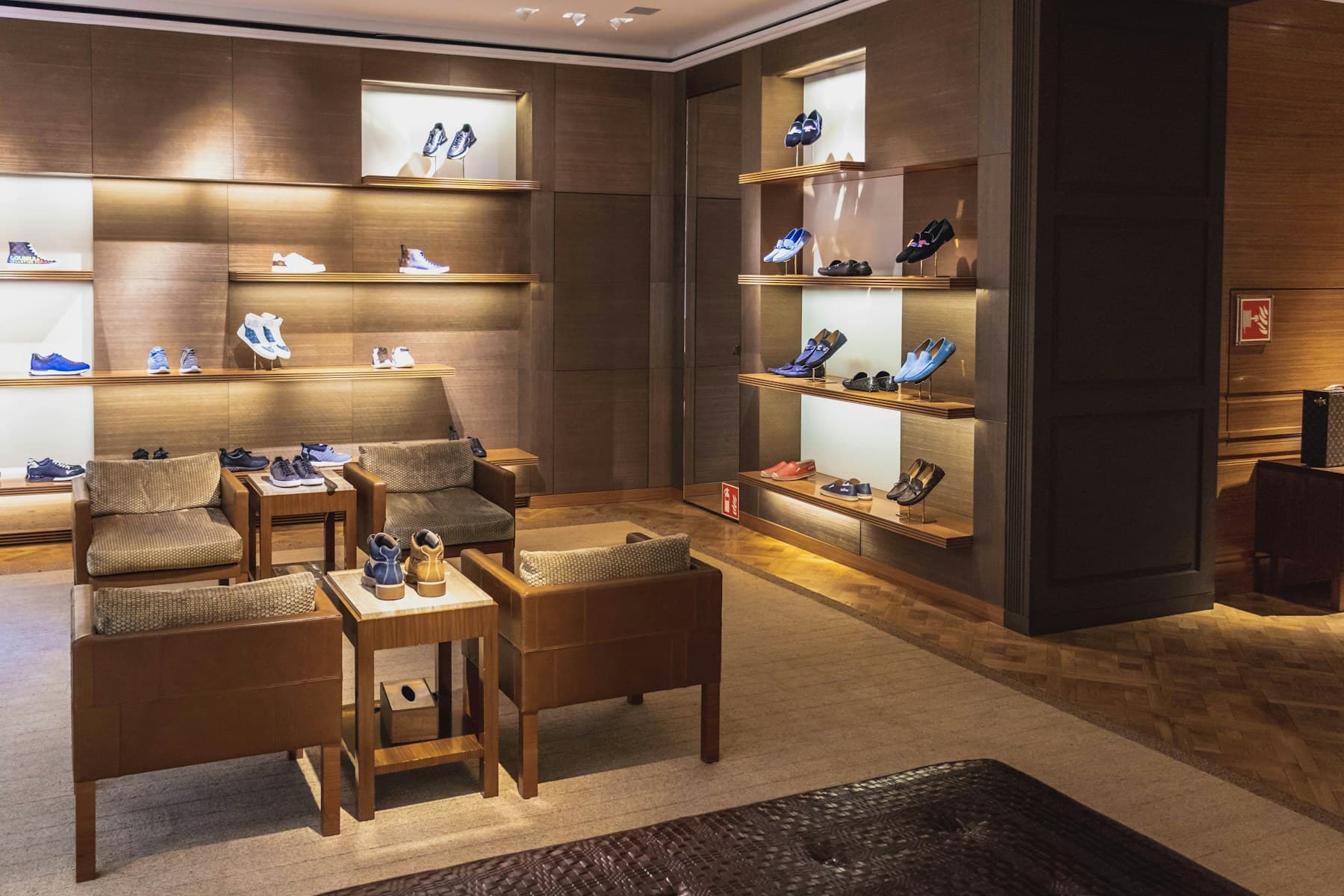 Luxury showroom interior with premium products displayed in a warm, modern setting.